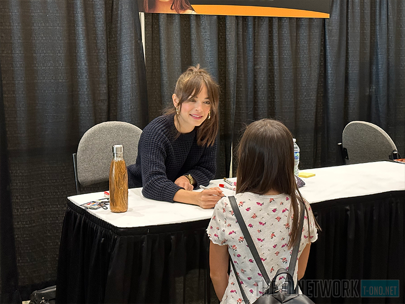 Actress Kristin Kreuk meeting a fan.