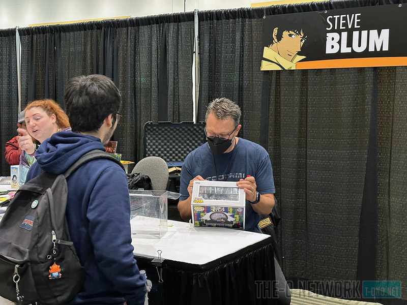 Voice actor Steve Blum signing a Funko Pop!